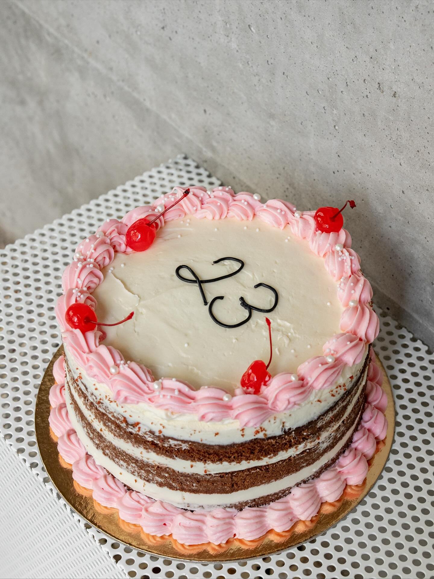 Naked birthday cake with pink buttercream – Black Eyed Kate